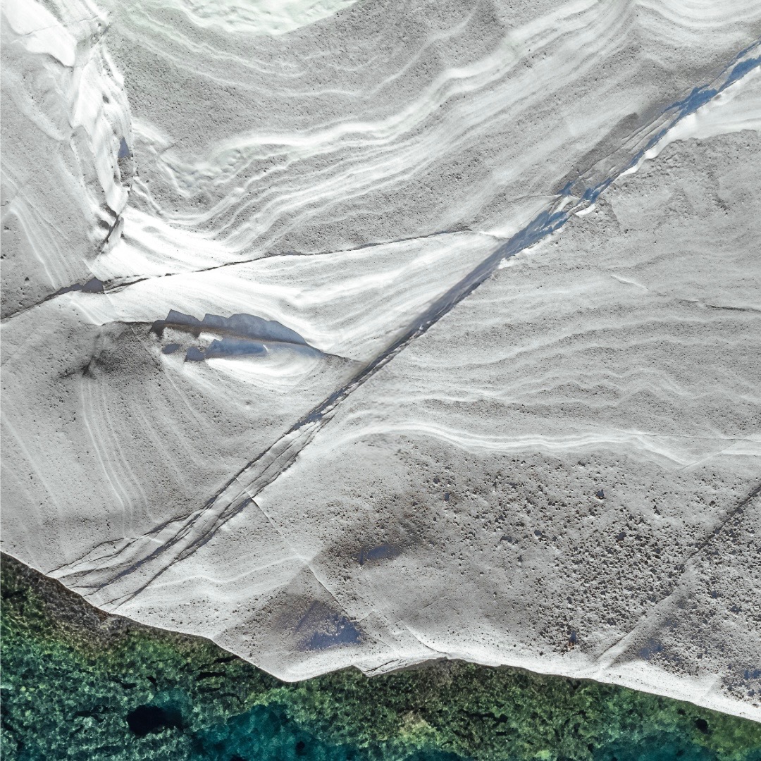 Inhabiting absolute white: a private exploration through the thresholds of Milos' lunar architecture.